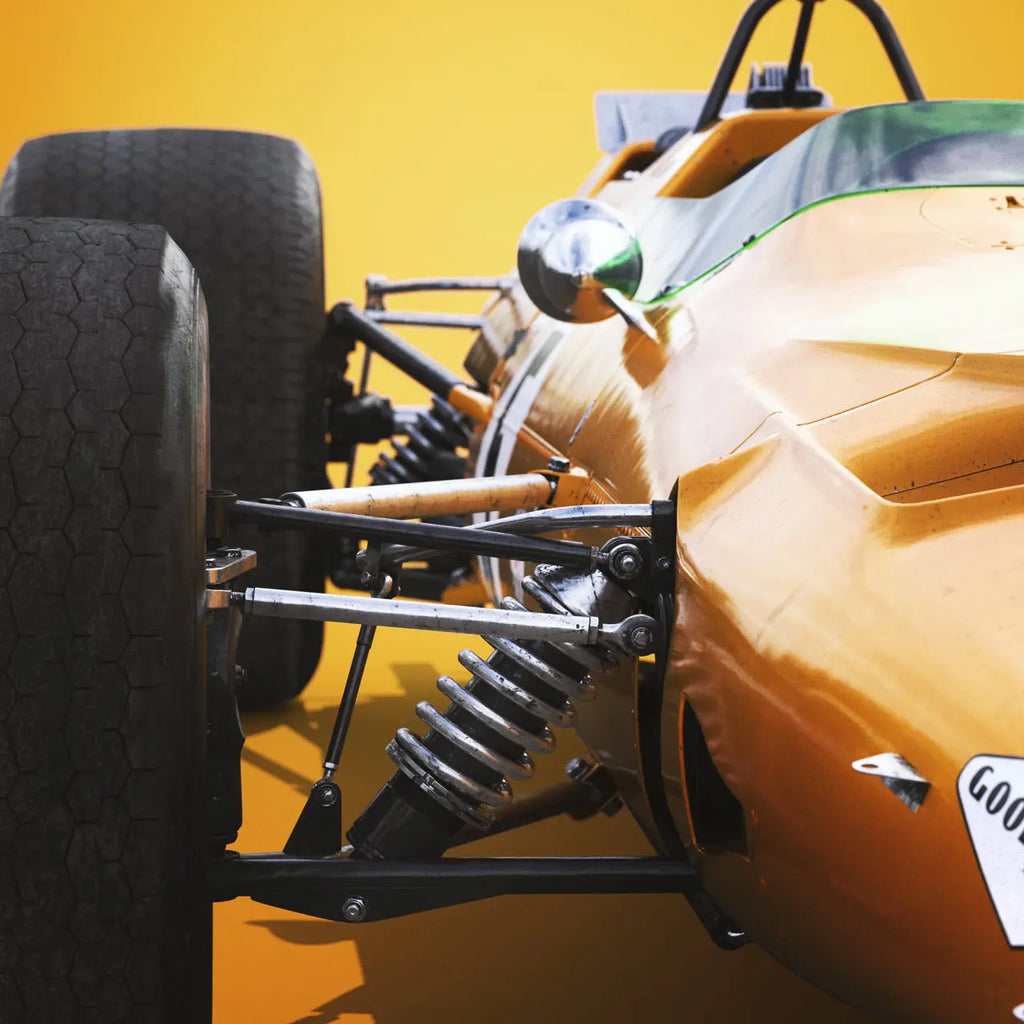 Zoom sur les amortissuers de la McLaren Papaya de Bruce McLaren modélisée en 3D du poster Automobilist